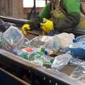 Sorting home recyclable materials at a recycling center
