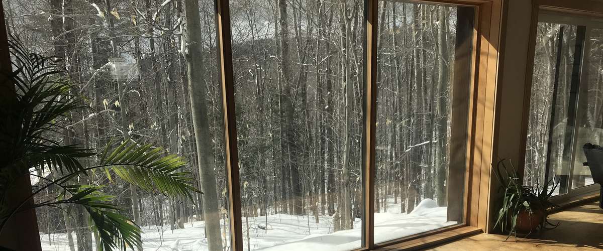 Low-E coatings on windows reflect heat and save energy during summer and winter