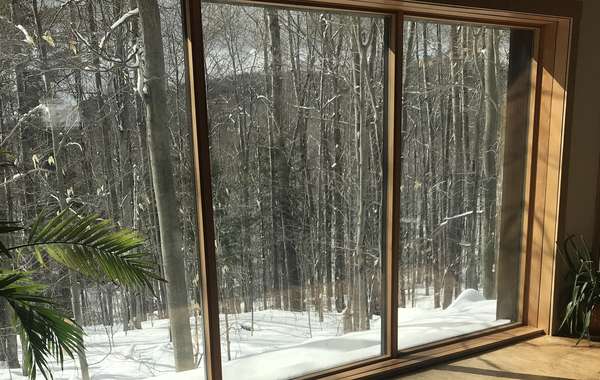 Low-E coatings on windows reflect heat and save energy during summer and winter