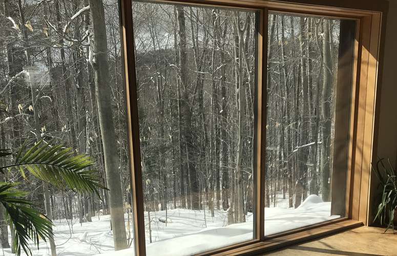 Low-E coatings on windows reflect heat and save energy during summer and winter