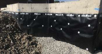 Basement foundation with exterior dimple membrane for water protection