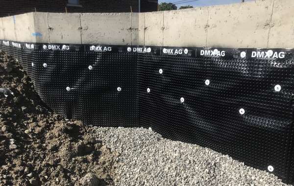 Basement foundation with exterior dimple membrane for water protection