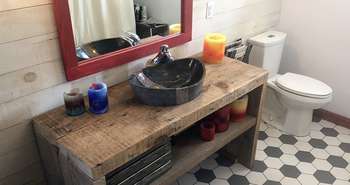 Recycled barn beams and a refinished clawfoot bathtub