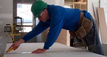 Installing recycled drywall in the Edelweiss House