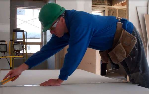 Installing recycled drywall in the Edelweiss House