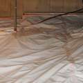 Crawlspace radon barrier installation for radon mitigation