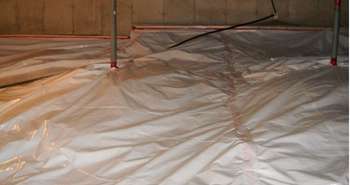 Crawlspace radon barrier installation for radon mitigation