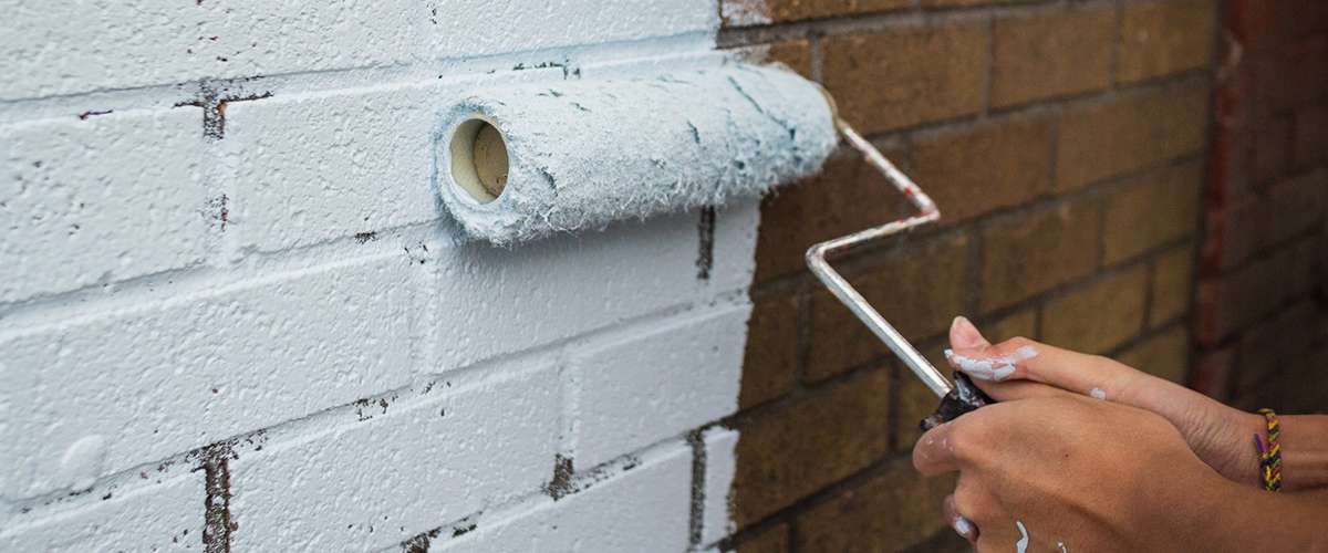 Repainting and refinishing brick facades