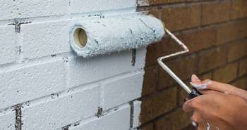 Repainting and refinishing brick facades