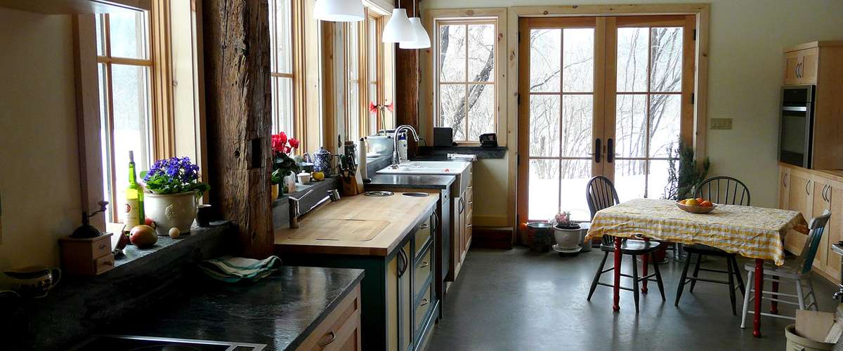 Bathroom with refinished claw foot tub and barn board trim in a home c