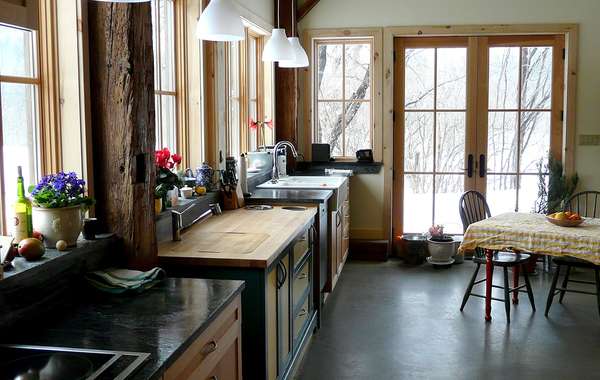 Bathroom with refinished claw foot tub and barn board trim in a home c