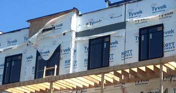 Tyvek home wrap left exposed to wind and UV rays