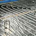Waterproof floor screeding with underfloor hydronic heating