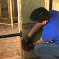 Installing soundproofing batts in interior partition walls of drywall