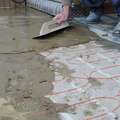 Waterproof floor screeding with under floor electric heating