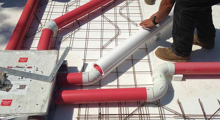 Air-heated radiant floor details in a frost protected shallow foundation slab forms 