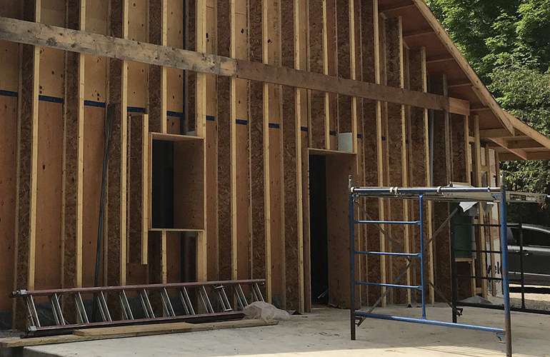 Larsen trusses with dense pack cellulose insulation for Passive House