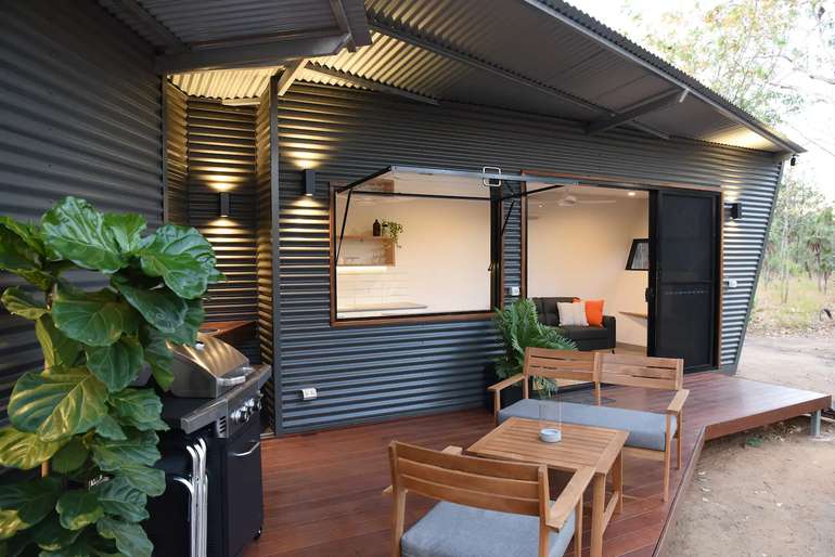 This warm climate shipping container home has a cool deck