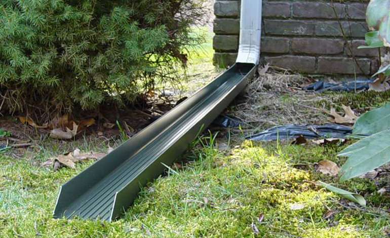 Gutter downspout extensions prevent basement flooding