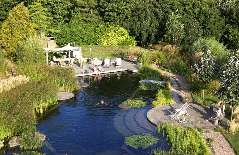 Natural solar heated swimming pools are the next best thing to living on a lake as a way to save energy 