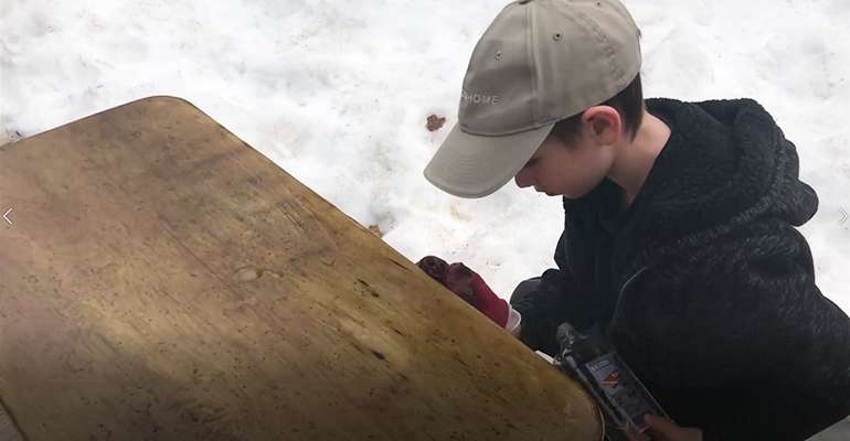 Applying SKYDD food safe natural mineral oil wood finish to a table