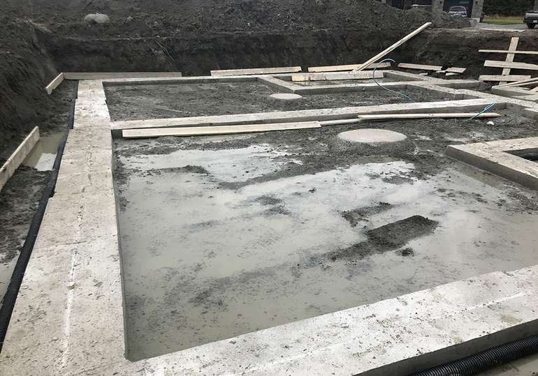 Footings are rarely if ever sealed against ground moisture, so they continually absorb moisture from the ground and deposit it into walls where it leads to mold and rotting walls. 