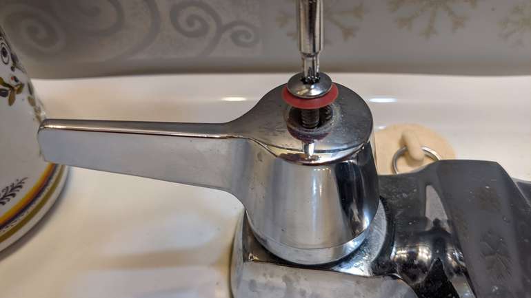 Firstly unscrew the levers off the leaking faucet