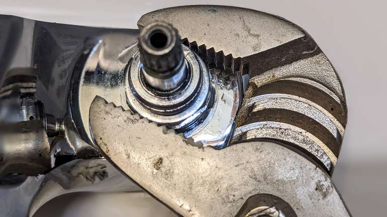 Carefully screw the repaired faucet cartridge back into the tap body - sure hope this fixes the drips!