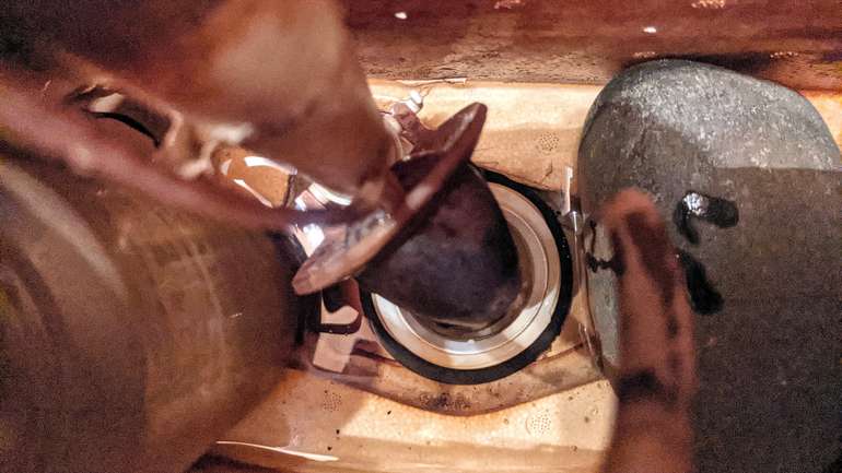 This is the Toilet Flapper in rubber and leaking water - ready for replacement