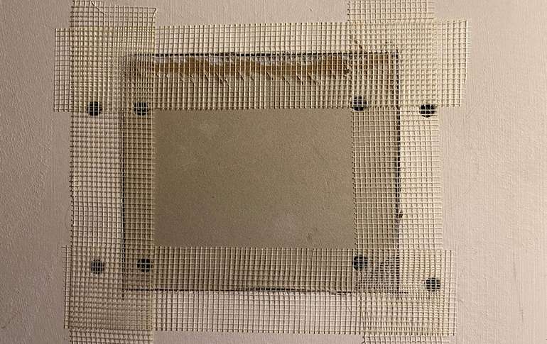 Apply self adhesive drywall tape to your drywall repair. 