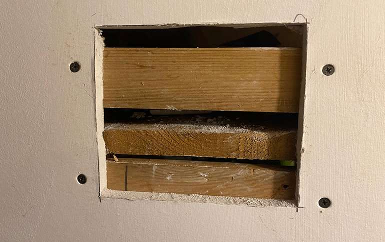 replacing drywall - after you cut the damaged section put in wood as backing. 