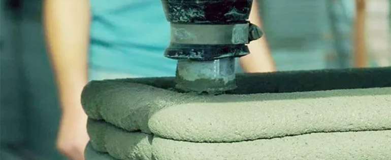 Printing a 3D house layer by layer © ICON