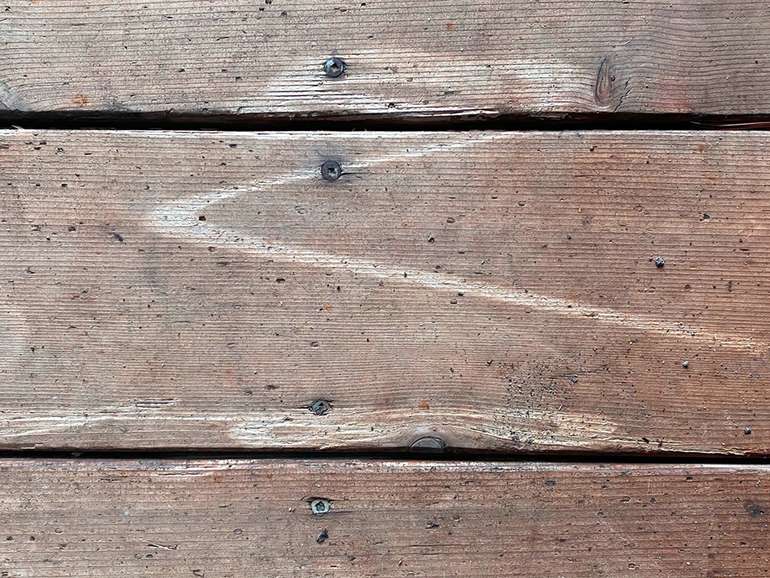 The mark of Zorro! Hold a pressure washer way from wood decks so it won't cause damage.