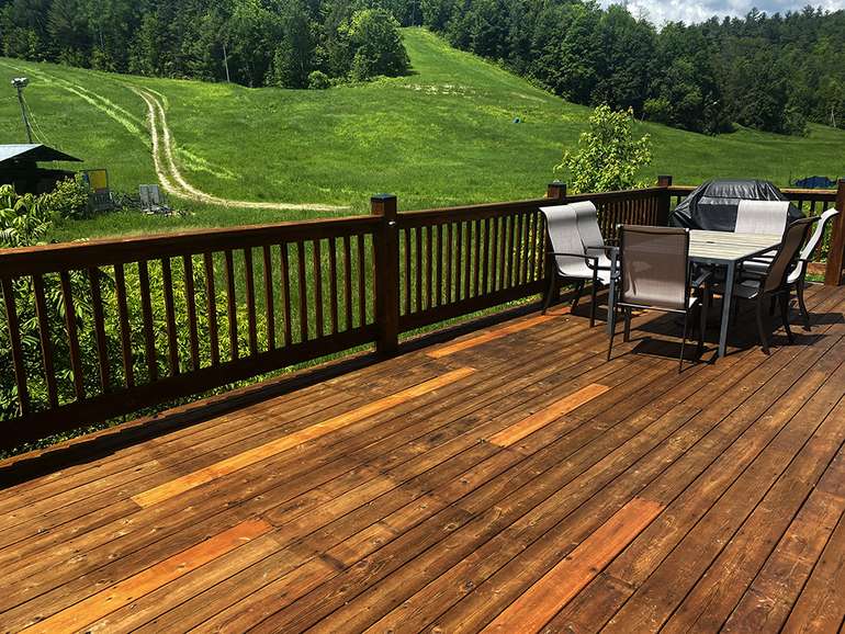 The pressure washed and renovated cedar deck with new stain - a huge improvement!
