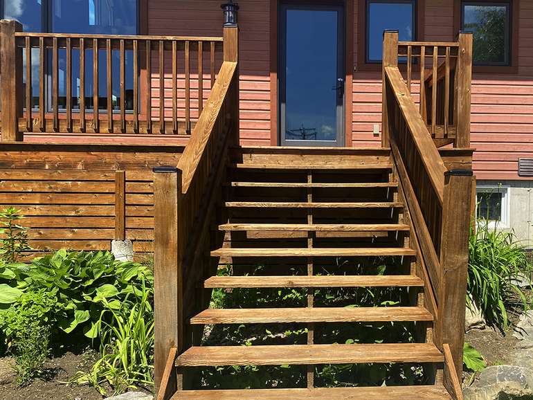restoring an old cedar deck to look new - staining the deck stairs