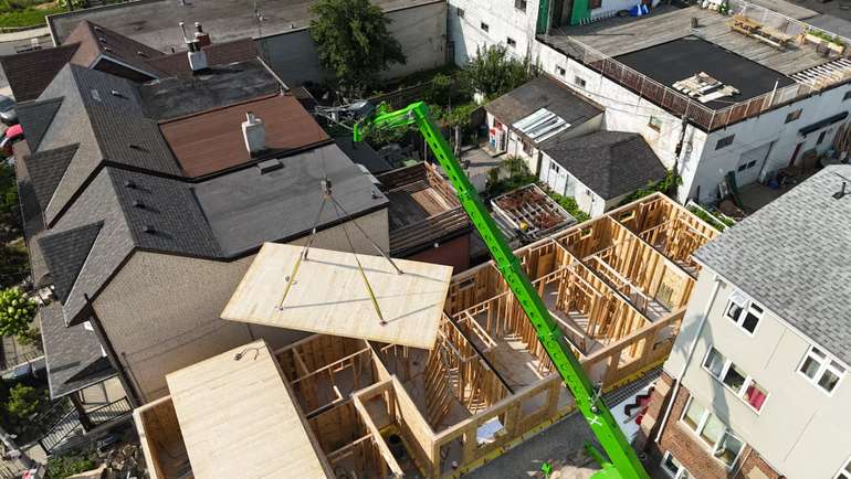 Assembly utilizes a modular approach to construction, incorporating components like cross-laminated timber floor systems, prefabricated bathroom and kitchen units, along with wall and ceiling panels designed for quick assembly.