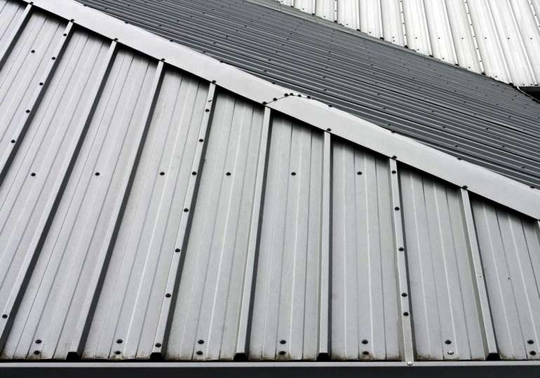 Where to put screws when installing metal roofing