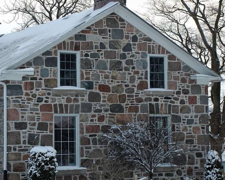 short roof overhangs makes exterior insulation more challenging on stone properties