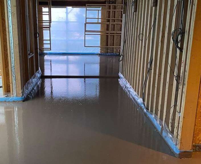 Poured concrete radiant cooled floor