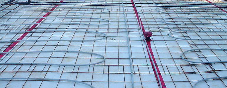 Hydronic radiant tubing for a slab-on-grade floor